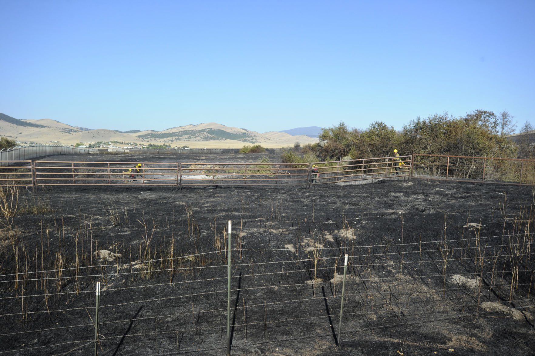 Firefighters mop up along Seven Mile Creek